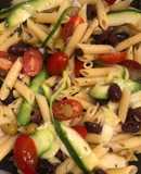 Penne pasta salad with zucchini and olives