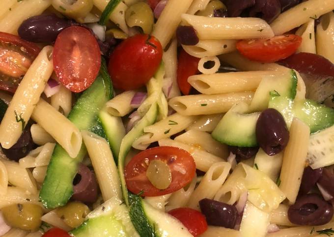 Penne pasta salad with zucchini and olives