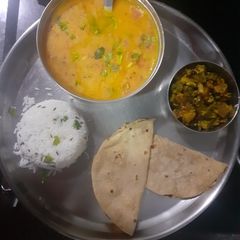 A picture of Dal fry jeera rice with karari bhindi.