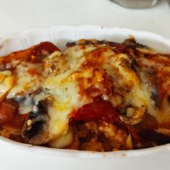 A picture of Baked Rice With Tomato Sauce and Cheese.
