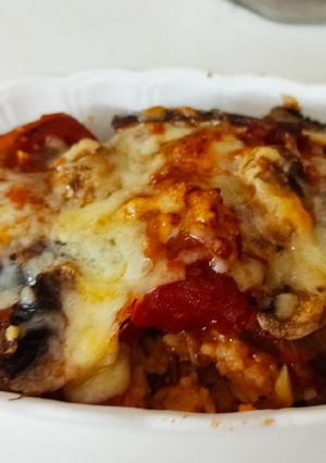 A picture of Baked Rice With Tomato Sauce and Cheese.