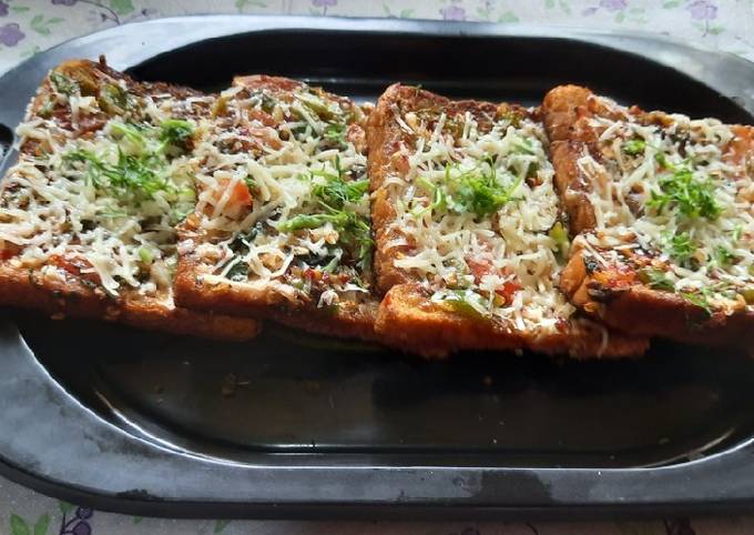 Steps to Make Ultimate Garlic Brown Bread mix vegetables cheese mini bread pizza