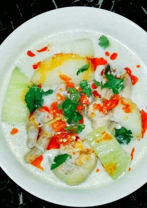 A picture of Spicy and Creamy Tom Kha Gai (Thai Chicken Coconut Soup).