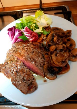 A picture of Steak and mushrooms.