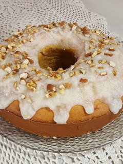 Una foto de Budín de mandarina 🍊 con glaseado de coco, nuez y almendra - Con manteca o con aceite