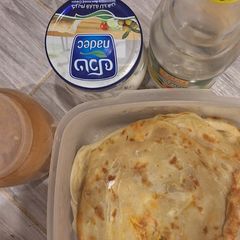 A picture of Paratha with cheese, cinnamon and rose water.