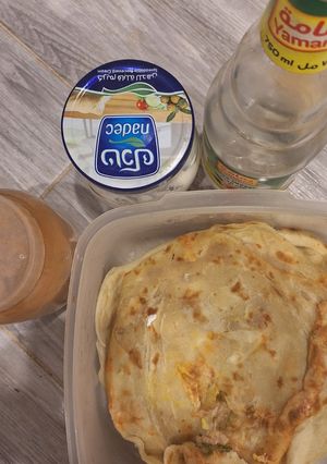 A picture of Paratha with cheese, cinnamon and rose water.