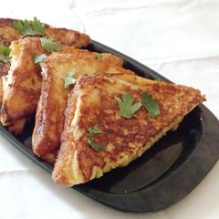A picture of Vegetable and cheese stuffed egg dip sandwich.