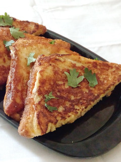 A picture of Vegetable and cheese stuffed egg dip sandwich.