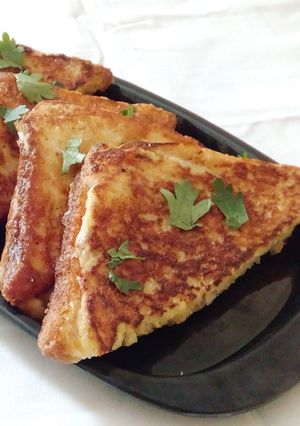 A picture of Vegetable and cheese stuffed egg dip sandwich.