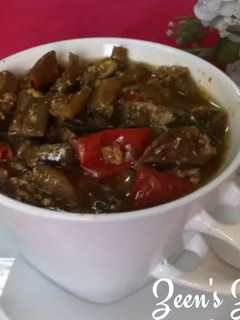 A picture of Green Chillies and Tamarind Pickle.