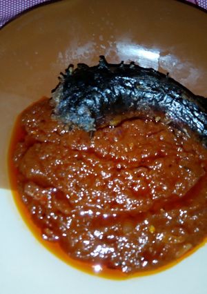 A picture of Smoked fish with Fresh Tomatoes Sauce.