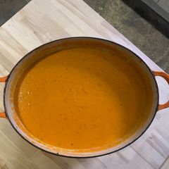 A picture of Tomato and carrot soup.