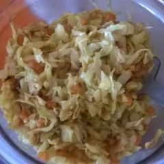 A picture of Fried cabbage with carrots.