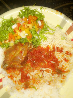 A picture of Rice #stew with salad.