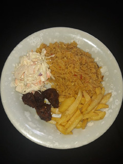A picture of Jollof rice,chips, pepper meat n coleslaw.