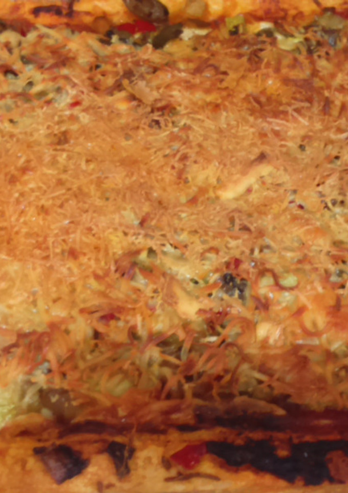 Una foto de Coca de hojaldre con verduras