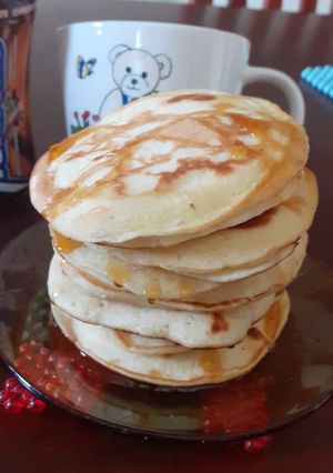 A picture of Fluffy Pancakes drizzled with honey.