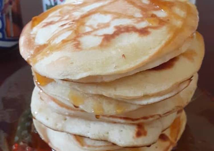 Simple Way to Make Homemade Fluffy Pancakes drizzled with honey