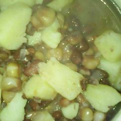 A picture of Stewed githeri cooked with potatoes.