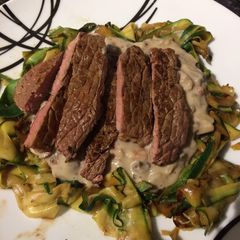 A picture of Mushroom and garlic sauce with courgette ribbons and pan fried steak.
