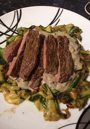 A picture of Mushroom and garlic sauce with courgette ribbons and pan fried steak.