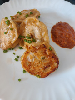 A picture of Prawn Potstickers with Chilli Garlic sauce.