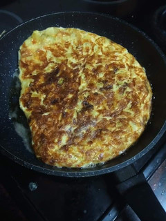 Una foto de Tortilla de papas, cebolla y calabacín