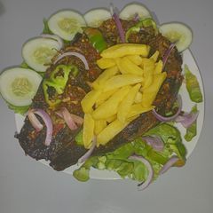 A picture of Grilled catfish with chips.