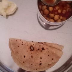 A picture of Chole with roti.