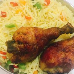 A picture of Fried rice and chicken.