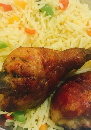 A picture of Fried rice and chicken.