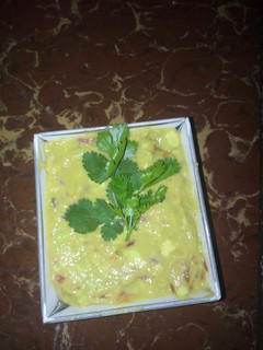 A picture of Guac with a banana.