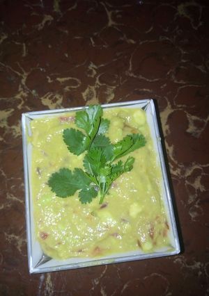 A picture of Guac with a banana.