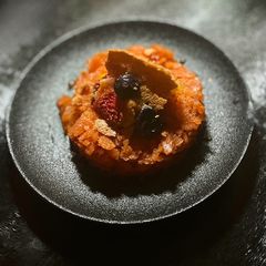 A picture of Bloody Mary Granita with berry meringue.