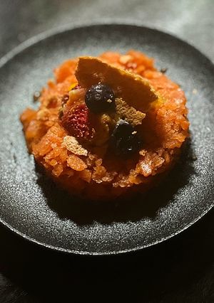 A picture of Bloody Mary Granita with berry meringue.