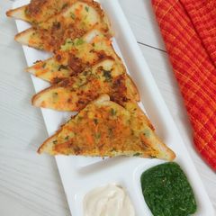 A picture of Veg French toast with Coriander Chutney.