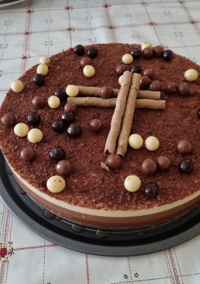Una foto de Tarta tres chocolates