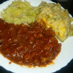 A picture of Beef stew (garam masala) with steamed cabbage and mukimo.