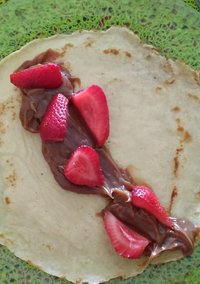Una foto de Panqueques con dulce de leche y frutillas!🤤