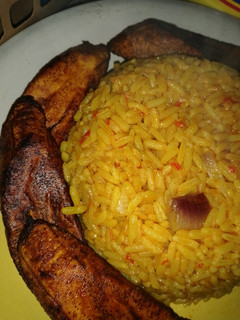 A picture of Red party jollof wit plantain(signature Maggi seasoning).
