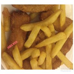 A picture of Chicken nuggets with french fries.