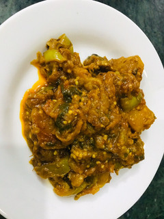 A picture of White Brinjal with potatoes.