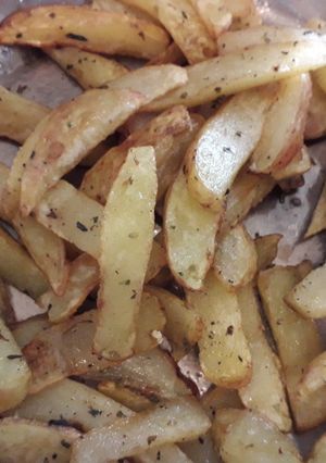 Una foto de Papas fritas con orégano