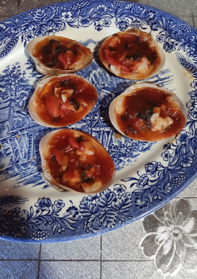Una foto de Conchas finas con salsa