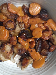 A picture of Stove top pork fat and carrots.