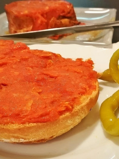 Una foto de Media tostada untada con sobrasada