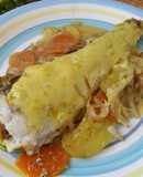 Merluza al horno en cama de zanahoria, zapallitos y cebolla caramelizada