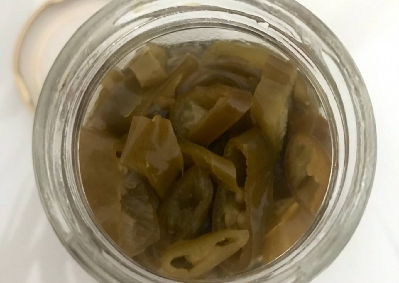 Homemade pickled green chilies