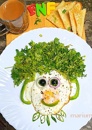 A picture of Half fried egg.